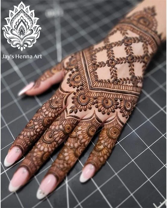 Bloom Scroll Art Blending Into Back Hand Mehndi Design Bloom Scroll Art Blending Into Back Hand Mehndi Design